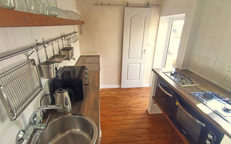 Kitchen with door to bathroom and to patio/terraces